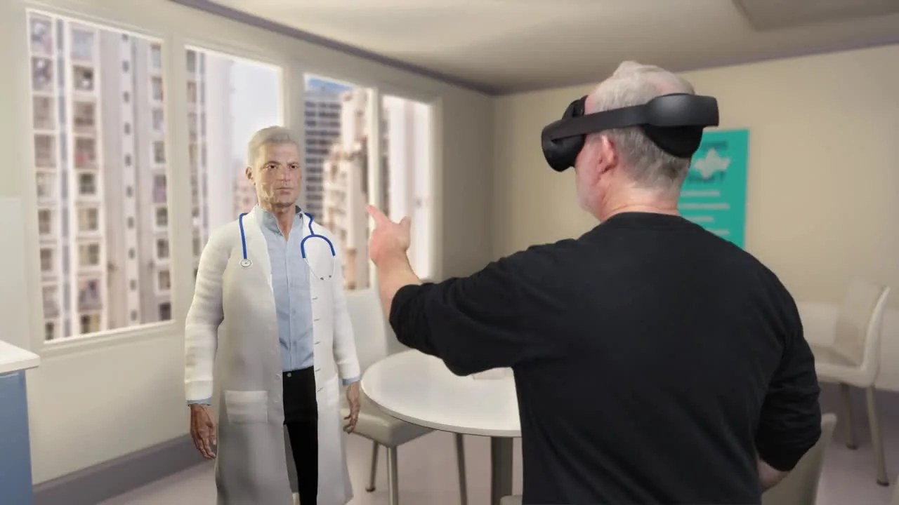 A man wearing a mixed-reality headset points toward an avatar in a white coat, in a simulated meeting room