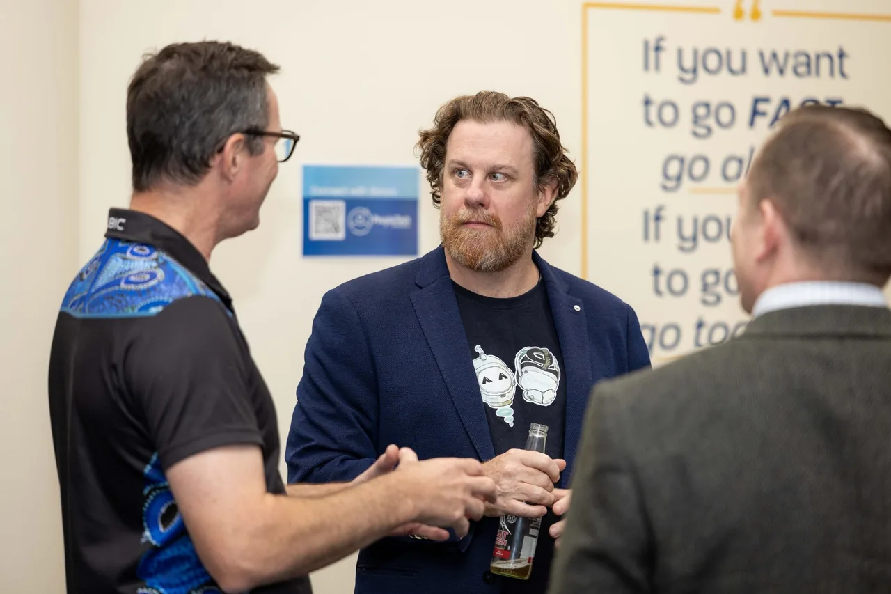 Simon Lowe talks with guests at the 18 July 2024 launch of PTR's VR Training Library in Townsville.