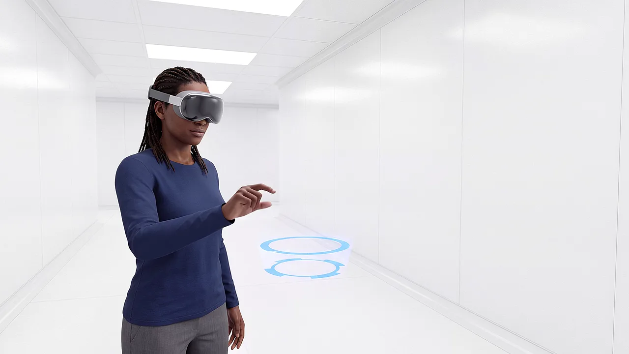 A technician reaches toward floating rings in a corridor.