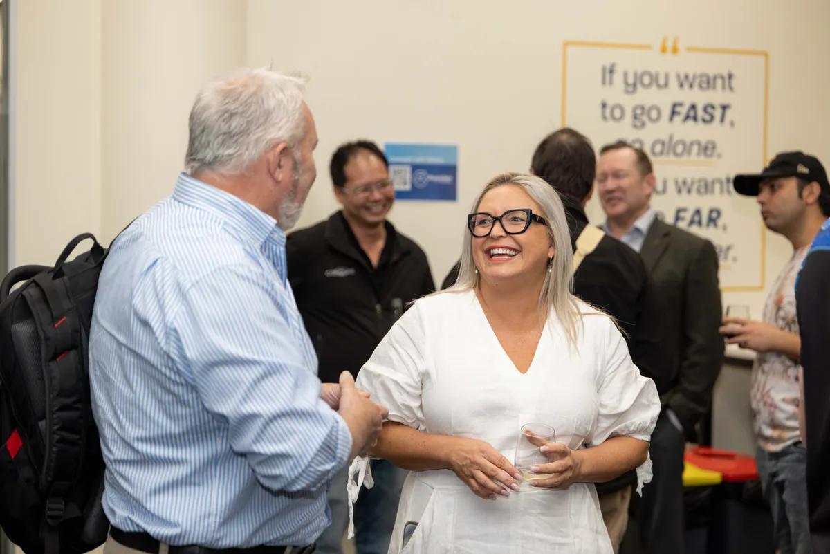 Greeting guests beside the wall quote. PTR VR Library public launch at Smart Precinct NQ, Townsville, 18 July 2024.