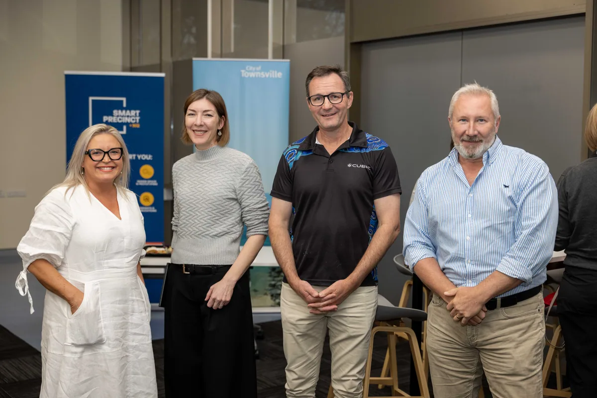 A group portrait by the event banners. PTR VR Library public launch at Smart Precinct NQ, Townsville, 18 July 2024.