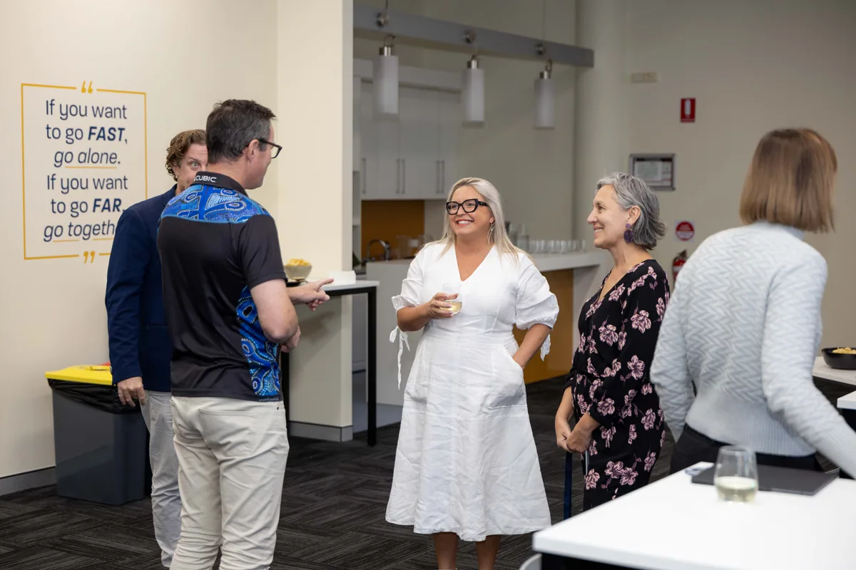 Guests arriving with drinks before the talks. PTR VR Library public launch at Smart Precinct NQ, Townsville, 18 July 2024.