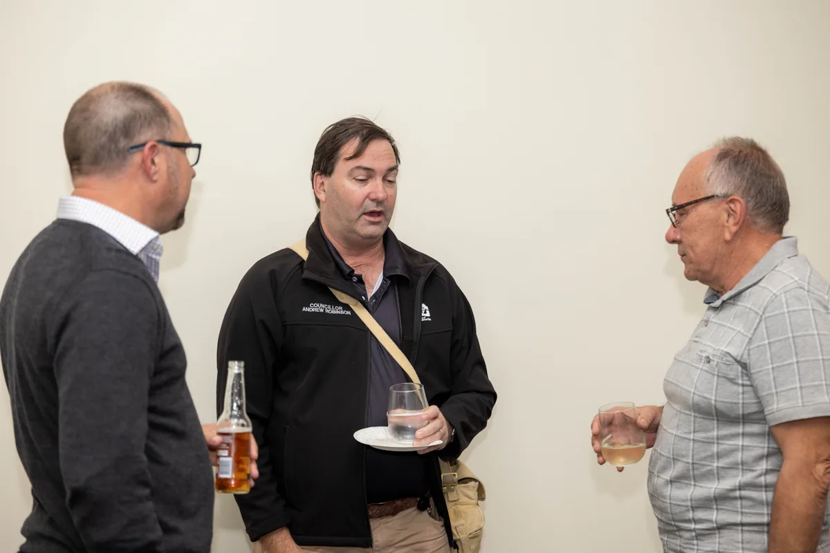 Three guests with drinks after the session. PTR VR Library public launch at Smart Precinct NQ, Townsville, 18 July 2024.