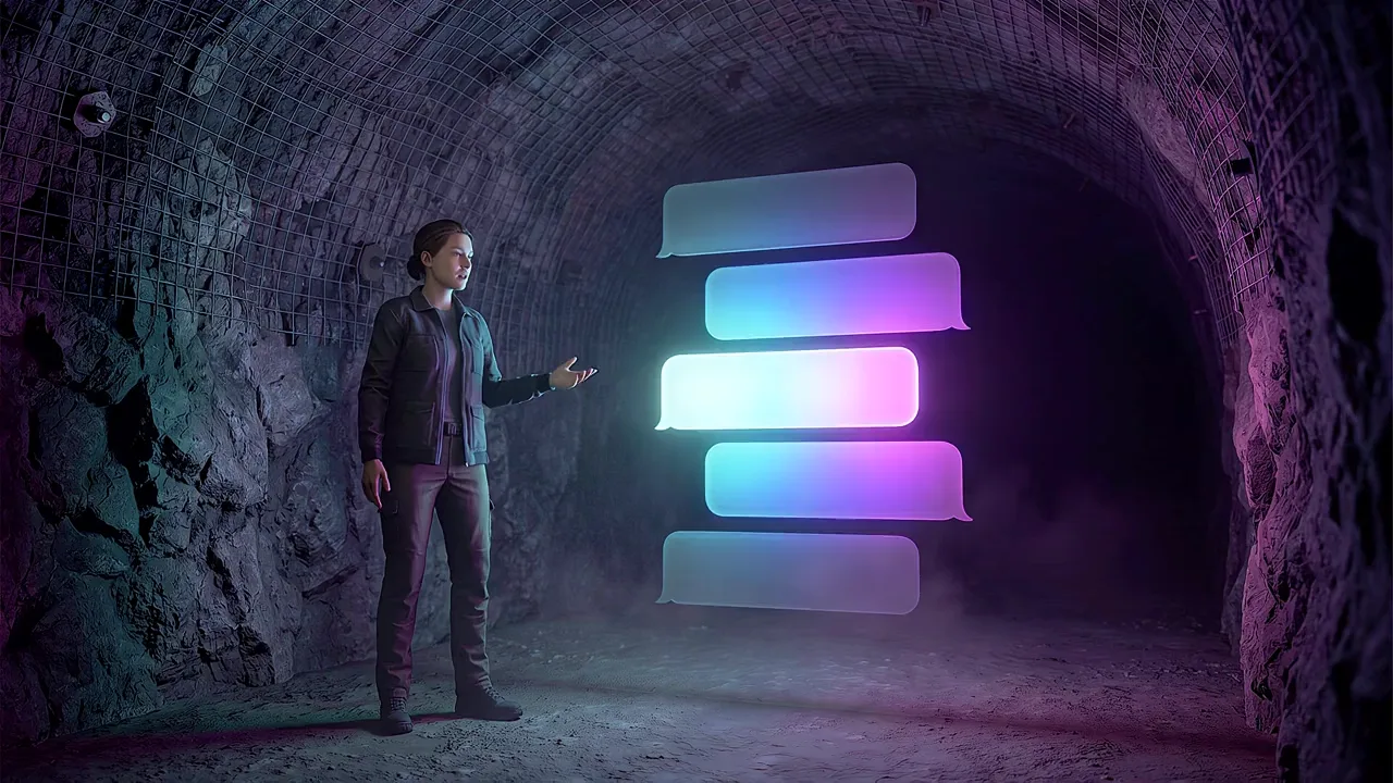 A man stands in a rock tunnel beside a stack of glowing message panels.