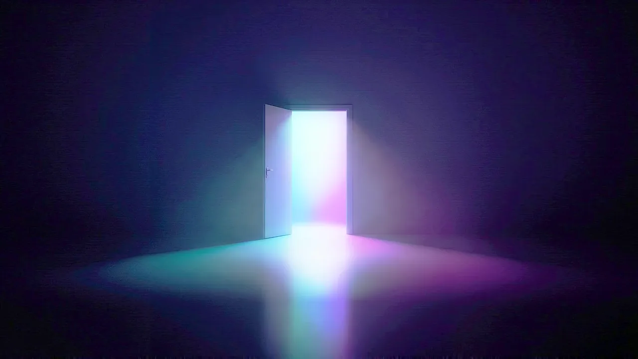 A door stands open in a dark room, bright coloured light spilling through it across the floor.