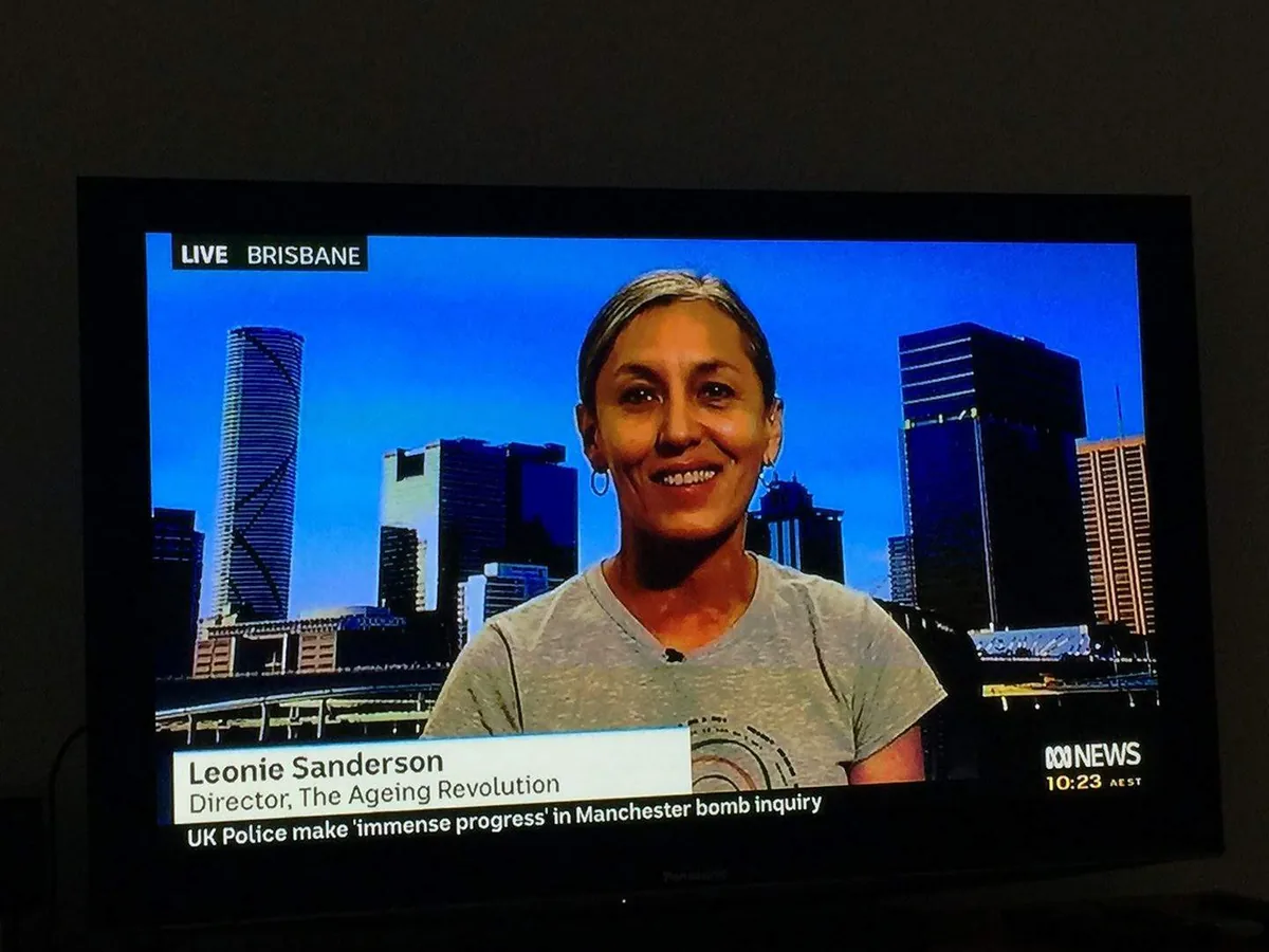 Leonie Sanderson interviewed live on ABC News from Brisbane, captioned as Director of The Ageing Revolution.